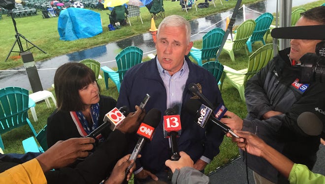 Indiana Gov. Mike Pence speaks during a news conference before attending Symphony on the Prairie for a Fourth of July concert in Fishers, Ind. Pence is one of several Republicans Trump is considering for his vice presidential running mate.