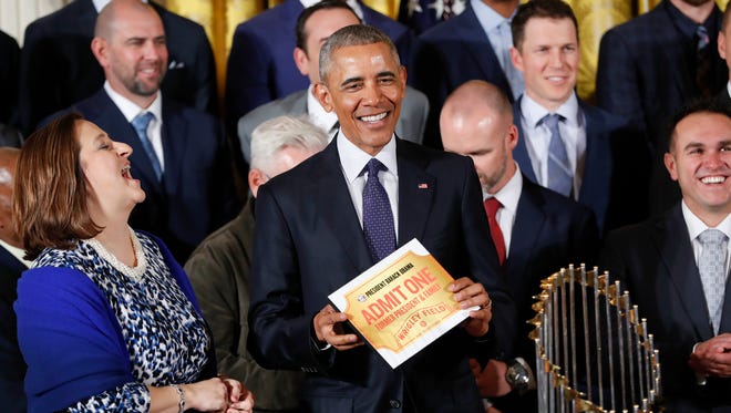 President Obama is given a lifetime ticket to Cubs games at Wrigley Field.