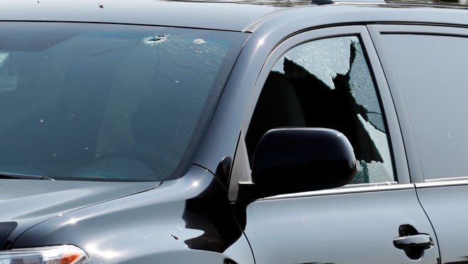A vehicle is seen with bullet holes in it at the scene of a shooting near a baseball field in Alexandria, Va., June 14, 2017, where House Majority Whip Steve Scalise of La. was shot at a congressional baseball practice.