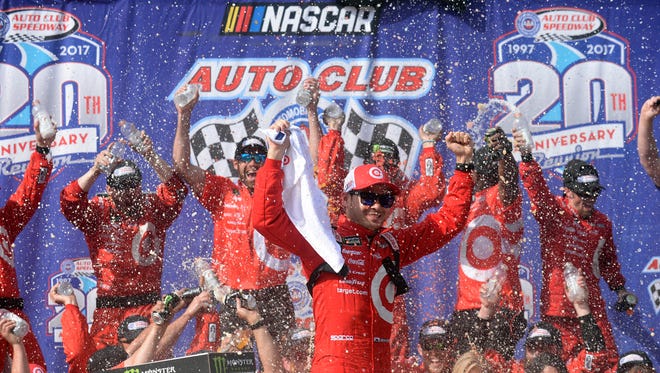 Kyle Larson celebrates after winning the Cup Series race at Auto Club Speedway on March 26, 2017, to compete a weekend sweep at the Southern California track.
