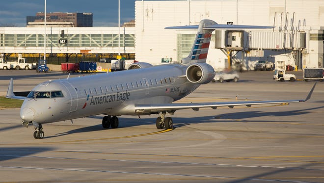 An American Eagle Bombardier CRJ-700 taxis to a gate at Chicago O'Hare International Airport on Nov. 11, 2016.