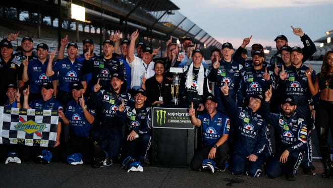 Kasey Kahne (center with towel) and team owner Rick Hendrick (left, white shirt) celebrate with the No. 5 Hendrick Motorsports crew at Indianapolis Motor Speedway after Kahne snapped a 102-race winless streak on July 23, 2017.