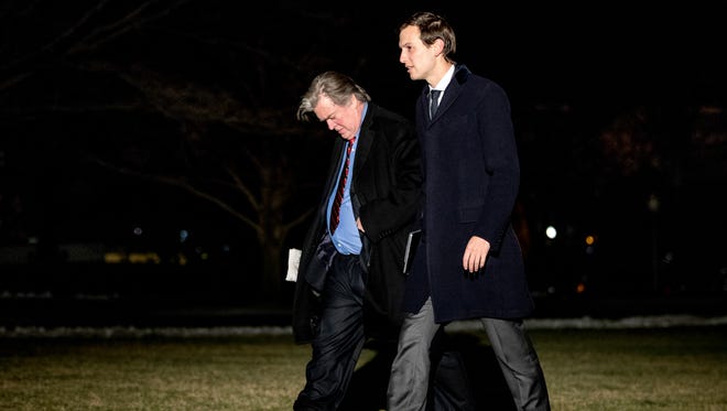 Kushner and Steve Bannon walk across the South Lawn of the White House after traveling to Detroit and Nashville with President Trump on March 15, 2017.