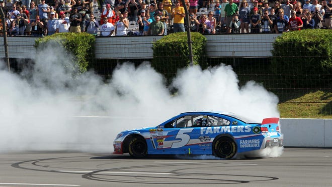 Kasey Kahne does a burnout after winning the GoBowling.com 400 at Pocono Raceway on Aug 4, 2013. Kahne also won at Bristol Motor Speedway in March.