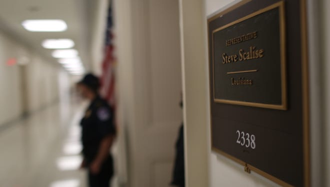 U.s. Capitol Police stand guard outside of House Majority Whip Representative Steve Scalise' office after he and other members of Congress were shot at by a gunman while playing baseball in Arlington, Va.