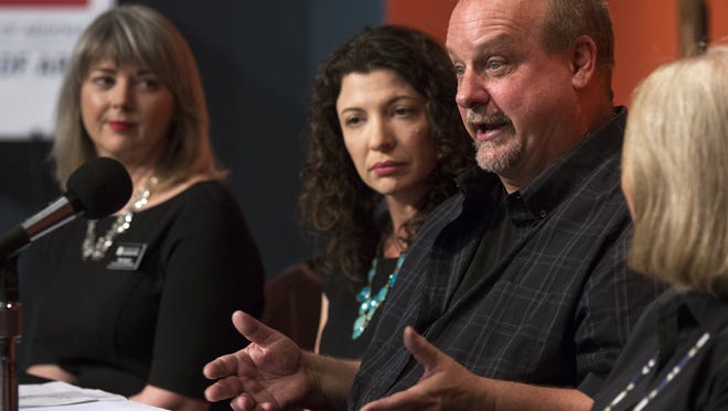 David Van Auker (second from right), the owner of the New Mexico antique shop who inadvertently purchased the Willem de Kooning's "Woman-Ochre" painting as part of an estate sale, answers questions during a press conference, Aug. 14, 2017, at the University of Arizona Museum of Art, 1031 N. Olive Road, Tucson.
