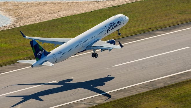 A JetBlue Airbus A321 takes off from Airbus' assembly line in Mobile, Ala.