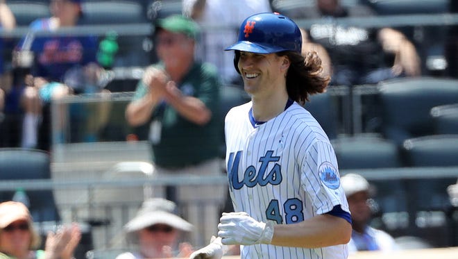 June 18: Mets starting pitcher Jacob deGrom hits a solo homer against the Nationals.