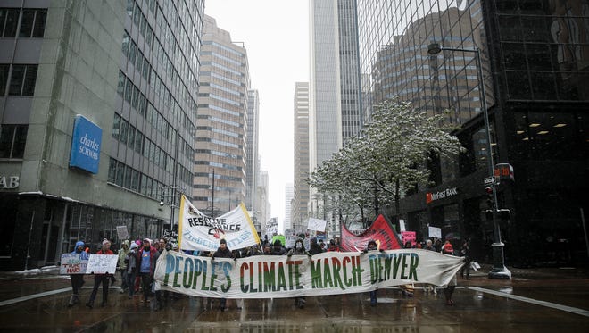 Thousands of protestors march around downtown Denver at the People's Climate March.