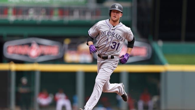 May 21: Rockies starting pitcher Kyle Freeland rounds the bases after a solo home run off Reds' Bronson Arroyo.
