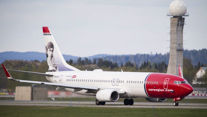 A Boeing 737-33S operated by Norwegian Air Shuttle sits on the tarmac at the Oslo Airport Gardemoen on May 2, 2014. Norwegian announced Thursday flights from Boston, New York and Baltimore-Washington to the Caribbean starting Dec. 3.