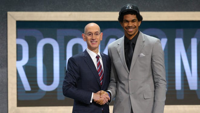 Jarrett Allen (Texas) is introduced by NBA commissioner Adam Silver as the No. 22 overall pick.