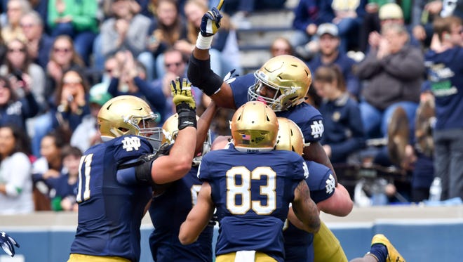 Notre Dame Fighting Irish running back Josh Adams (33) celebrates after a touchdown in the first quarter of the Blue-Gold Game at Notre Dame Stadium on April 22.