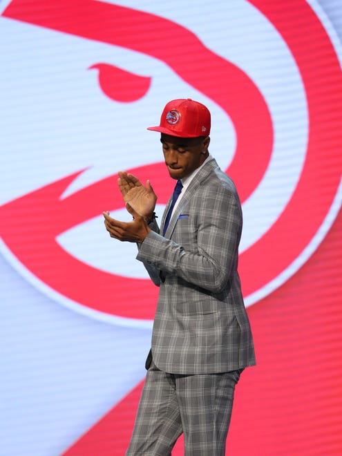 John Collins walks off stage after being introduced as the No. 19 overall pick to the Hawks in the first round of the 2017 NBA draft at Barclays Center.