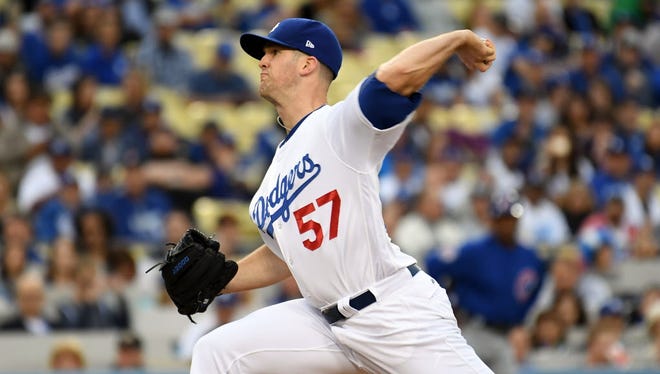 Los Angeles Dodgers starting pitcher Alex Wood (57) pitches against the Chicago Cubs in the first inning at Dodger Stadium.