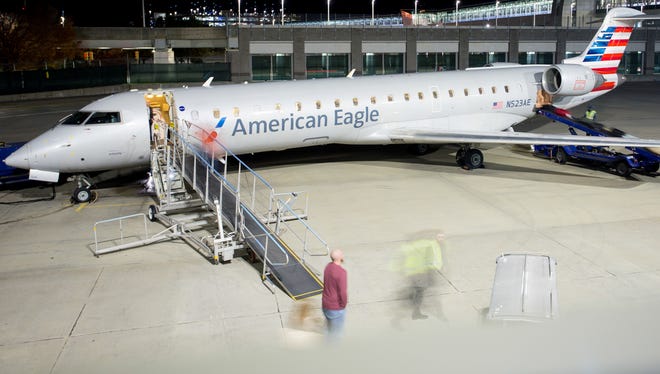 Passengers deboard an American Eagle Bombardier CRJ-700 at Providence T.F. Green International Airport on Nov. 11, 2016.