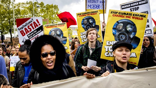 Thousands of people take part in the People's Climate March to call for an ambitious climate policy, on April 29, 2017 in Amsterdam.