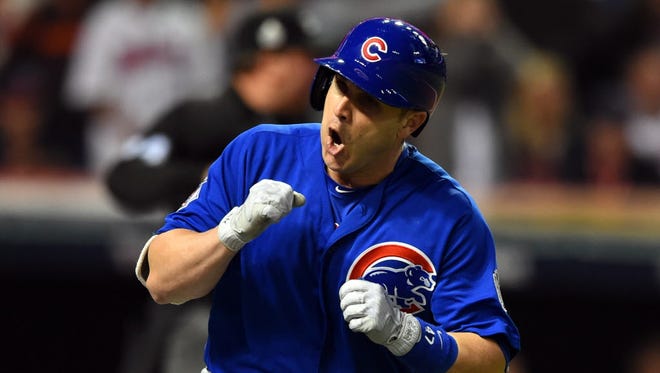 Game 7 in Cleveland: Cubs catcher Miguel Montero celebrates after hitting an RBI single in the 10th inning.