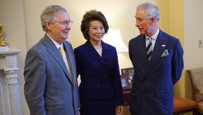 Britain's Prince Charles poses with Senate Majority Leader Mitch McConnell, R-Ky., and Elaine Chao on March 19, 2015, at the U.S. Capitol.