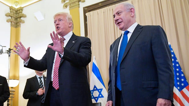 President Trump reacts to Bloomberg reporter Margaret Talev's question after he and Israeli Prime Minister Benjamin Netanyahu spoke to the press in Jerusalem Monday.