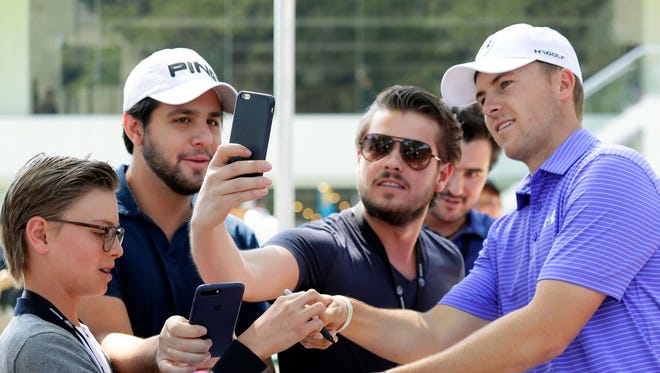 Jordan Spieth signs autographs and poses for photos during practice for the World Golf Championships Mexico Championship at Club De Golf Chapultepec on Feb. 28 in Mexico City.