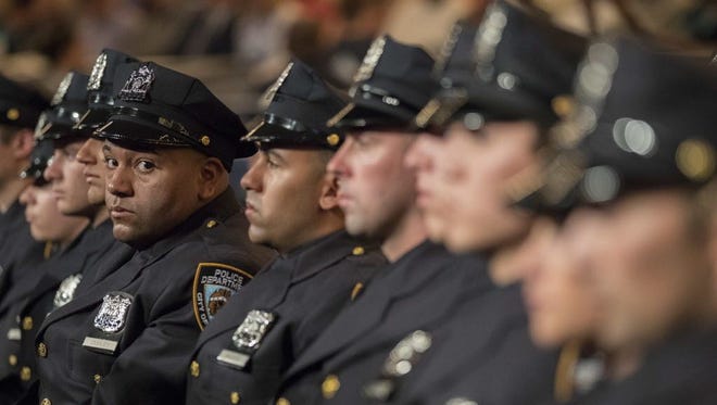 The newest members of the New York City police listen to the speakers during their graduation ceremony in New York City on June 29, 2017.