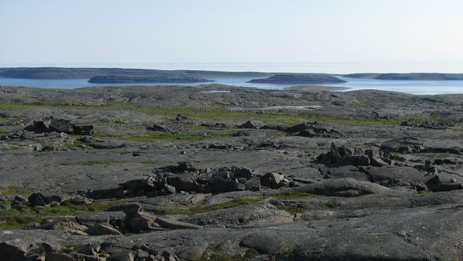 This is the Nuvvuagittuq Supracrustal Belt in Quebec, Canada that shows a few Nastapoka Islands in the distant background.