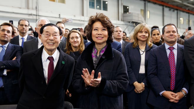 Chao listens as President Trump speaks at the American Center of Mobility on March 15, 2017, in Ypsilanti Township, Mich.