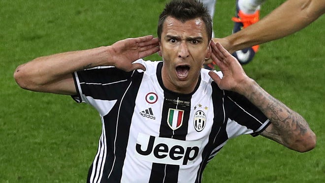 Juventus forward Mario Mandzukic celebrates his goal in the first half.