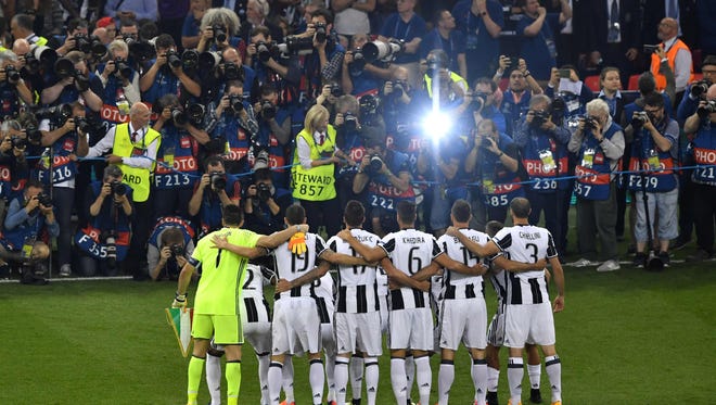 Juventus players pose for a photograph prior to the match.