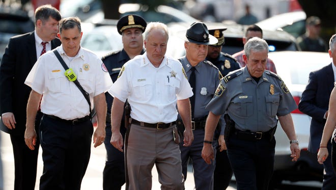 Alexandria, Va. Police Chief Michael Brown, right, and others walk to speak to the media about the shooting in Alexandria, Va., Wednesday, June 14, 2017, where House Majority Whip Steve Scalise of La. was shot at a Congressional baseball practice.