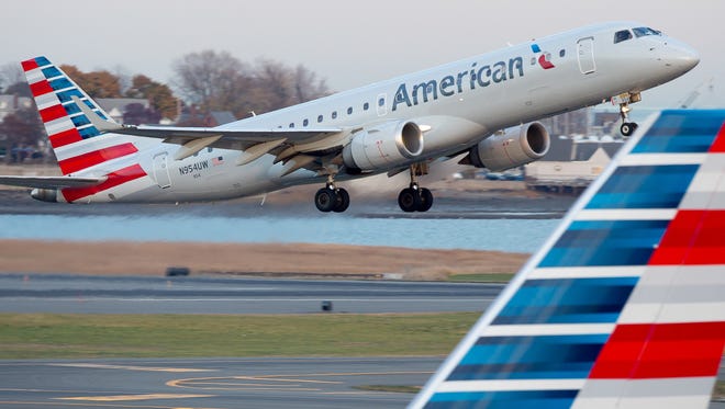 An American Airlines Embraer E190 takes off from Boston Logan International Airport on Nov. 14, 2016.