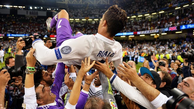 Real Madrid forward Cristiano Ronaldo is celebrated after the UEFA Champions League final.