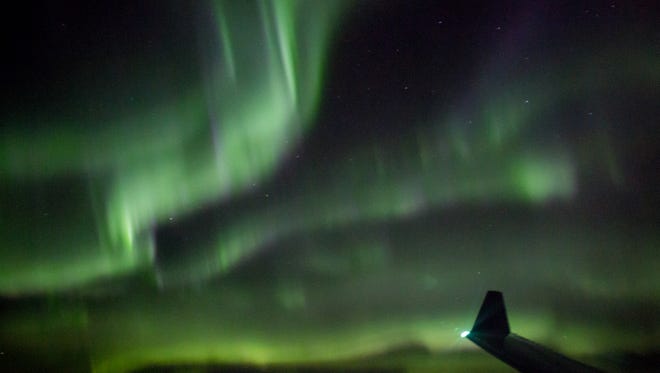 The northern lights put on a dazzling display over Greenland, seen from a Delta Air Lines flight from Seattle to Paris on Nov. 22, 2016.