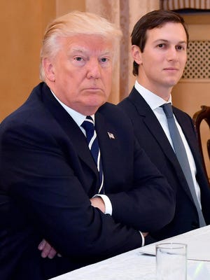 President Trump is pictured next to his senior advisor Jared Kushner during a meeting with Italian Prime Minister Paolo Gentiloni at Villa Taverna in Rome, Italy.