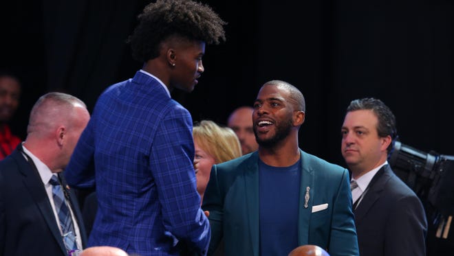 Los Angeles Clippers player Chris Paul greets draft prospects before the first round of the 2017 NBA Draft.