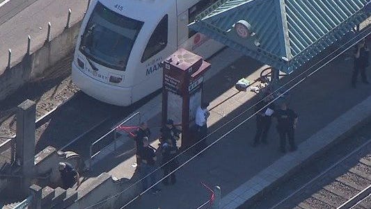 Police respond to a stabbing at the Hollywood Transit Center in Portland, Ore.