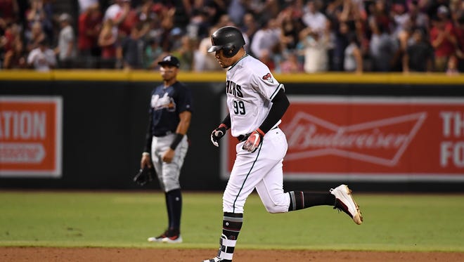 July 25: Taijuan Walker of the Diamondbacks rounds the bases after hitting a solo home run off of Mike Foltynewicz of the Braves.