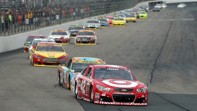 Kyle Larson (42), shown leading Kyle Busch (18) at New Hampshire Motor Speedway, scored eight top-five finishes during his rookie year in 2014.