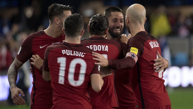 United States forward Clint Dempsey is congratulated after scoring a hat trick against Honduras during the second half of the men's World Cup qualifier at Avaya Stadium in San Jose.