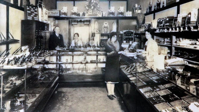 A historic photo from 1924 of John Daly (left) from his first pen shop at the Plankinton Arcade, which later become the Grand  Avenue Mall.
