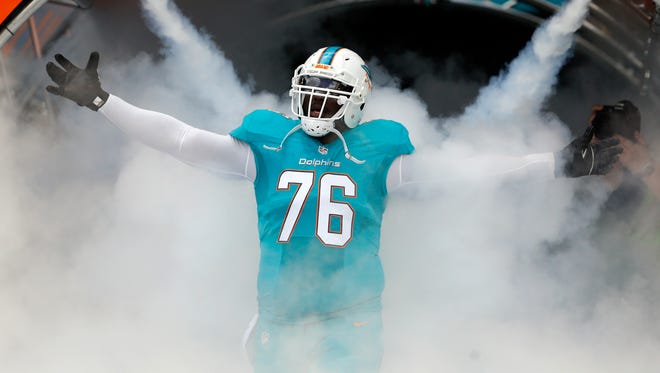Jan 1, 2017; Miami Gardens, FL, USA;  Miami Dolphins offensive tackle Branden Albert (76) is introduced before an NFL football game against the New England Patriots at Hard Rock Stadium. Mandatory Credit: Reinhold Matay-USA TODAY Sports ORG XMIT: USATSI-268710 ORIG FILE ID:  20170101_pjc_mb4_307.JPG