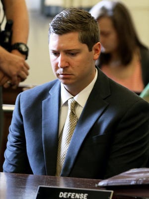 Ray Tensing, left, a former University of Cincinnati police officer, reacts June 23, 2017, has the jury in his trial tells a Hamilton County Common Pleas Court judge that they cannot come to a decision and she instructs them to continue deliberations. Tensing was facing murder and voluntary manslaughter charges in the July 19, 2015, death of Sam DuBose before a mistrial was declared.