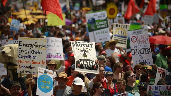 People march from the U.S. Capitol to the White House for the People's Climate March in Washington, D.C.