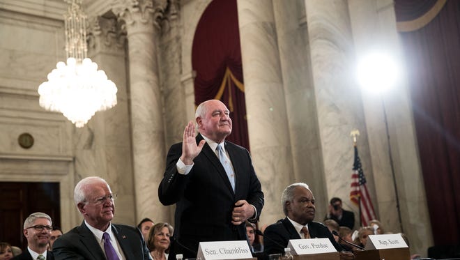 Sonny Perdue, President Trump's nominee to lead the Agriculture Department, is sworn in during his confirmation hearing before the Senate Agriculture, Nutrition and Forestry Committee on March 23, 2017.