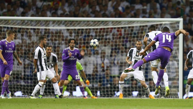 Real Madrid's Casemiro, shoots to score his team's second goal.