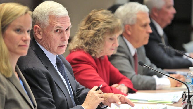 Governor Mike Pence addresses the panel at the end of the Indiana Education Roundtable meeting at the Government Center South, Monday, April 21, 2014.