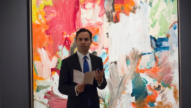 A Christie's official speaks in front of "Untitled XXV" by Willem de Kooning November 4, 2016 in New York during a press preview.
The oil on canvas is to be auctioned off November 15, 2016 at Christie's. / AFP / DON EMMERT / RESTRICTED TO EDITORIAL USE - MANDATORY MENTION OF THE ARTIST UPON PUBLICATION - TO ILLUSTRATE THE EVENT AS SPECIFIED IN THE CAPTION        (Photo credit should read DON EMMERT/AFP/Getty Images)