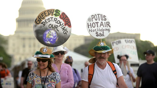 People gather near the U.S. Capitol for the People's Climate March before heading to the White House to protest President Donald Trump's environmental policies  on April 29, 2017 in Washington, D.C. Demonstrators across the country are gathering to demand  a clean energy economy.