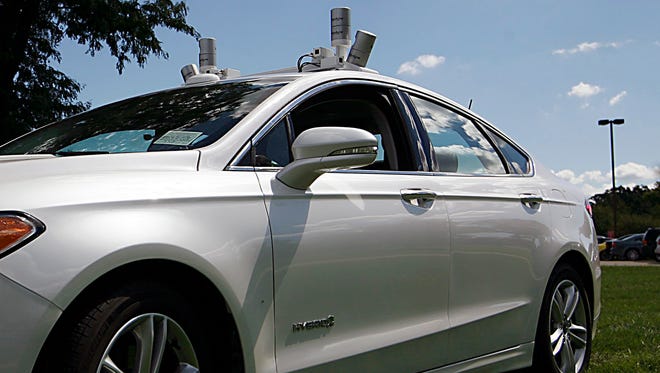 A Ford Fusion Hybrid autonomous test vehicle is shown equipped with LiDAR technology sensors on the roof of the vehicle at the Ford Product Development Center in Dearborn, Mich. Monday, Sept. 12, 2016. Gary Malerba/Special For DFP